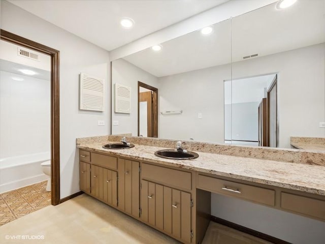 bathroom with vanity and toilet