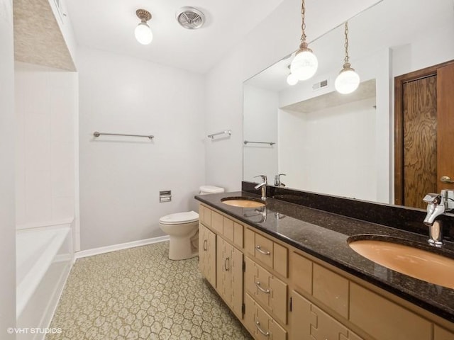 bathroom featuring vanity and toilet