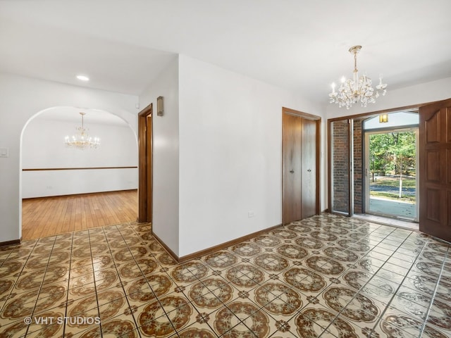 foyer featuring a chandelier