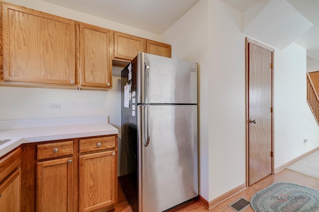 kitchen featuring stainless steel refrigerator