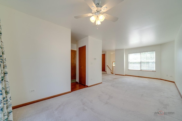 empty room with carpet floors and ceiling fan