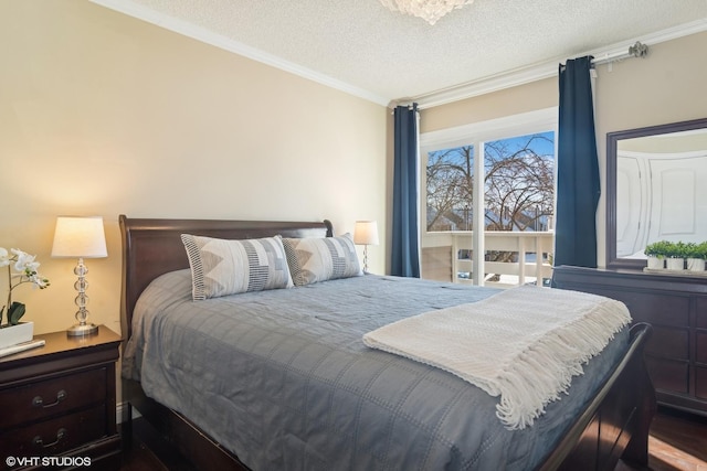 bedroom featuring ornamental molding and a textured ceiling