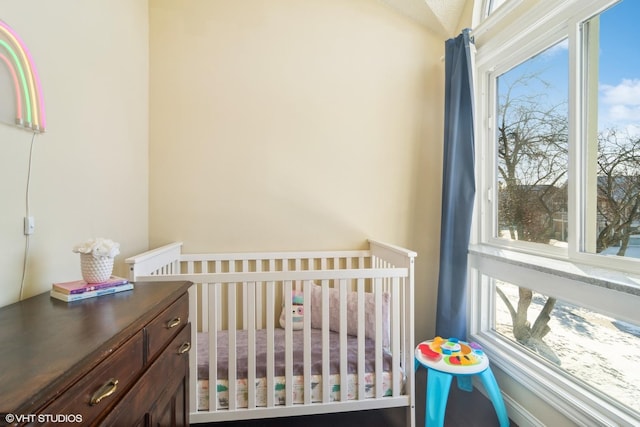 bedroom featuring a nursery area