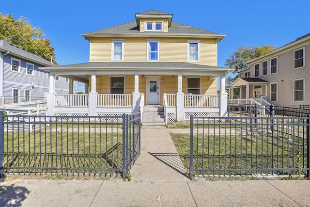 view of front facade with covered porch and a front lawn