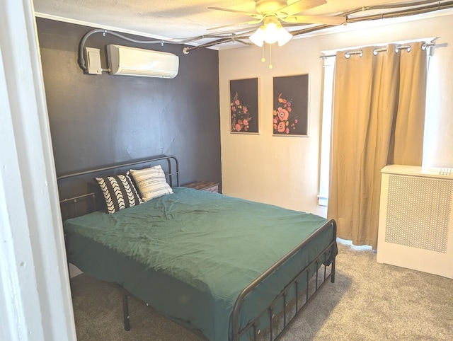 bedroom featuring carpet floors, a wall mounted air conditioner, a textured ceiling, and ceiling fan