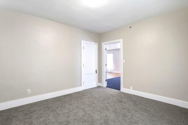 unfurnished room with carpet floors