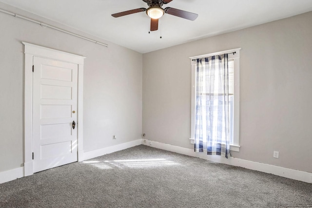 spare room with carpet flooring and ceiling fan