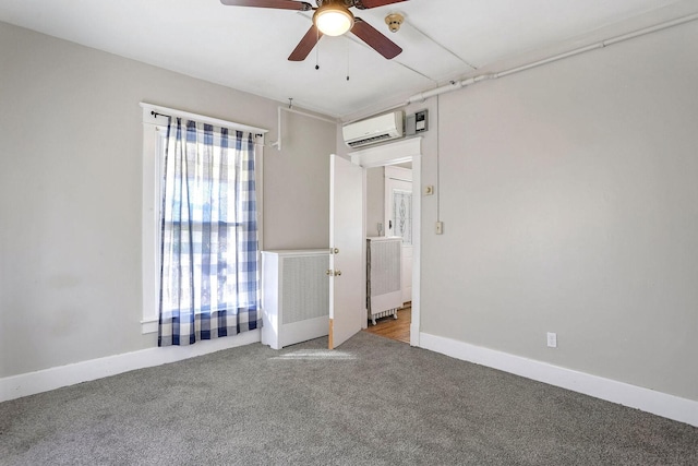 carpeted empty room with ceiling fan and a wall mounted air conditioner