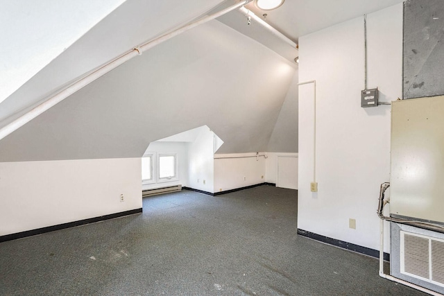 bonus room featuring lofted ceiling and baseboard heating