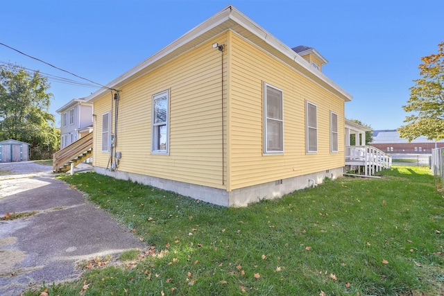 view of home's exterior featuring a yard