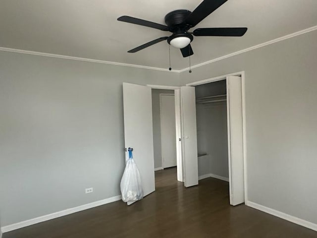 unfurnished bedroom with dark hardwood / wood-style flooring, ornamental molding, a closet, and ceiling fan