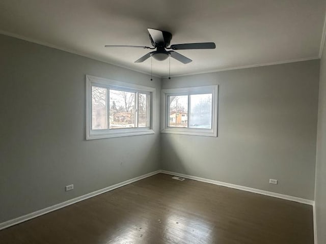 unfurnished room featuring ceiling fan, ornamental molding, and dark hardwood / wood-style flooring