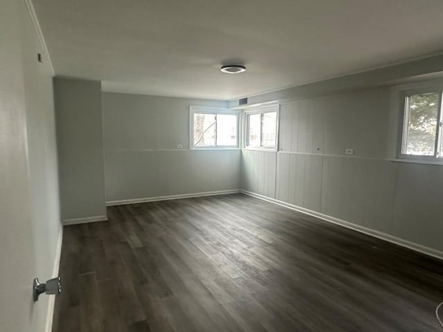 unfurnished room featuring dark wood-type flooring