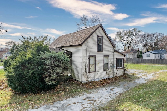 view of property exterior with a lawn