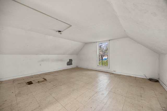 additional living space with lofted ceiling