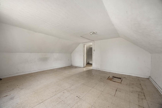 bonus room featuring lofted ceiling