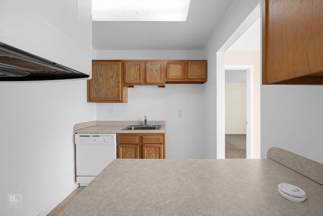 kitchen featuring white dishwasher and sink