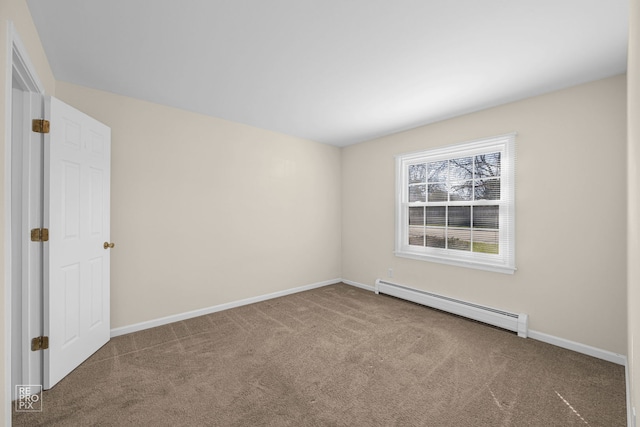 carpeted empty room featuring baseboard heating