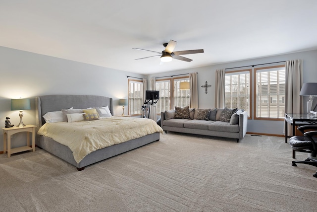 bedroom with light carpet and ceiling fan