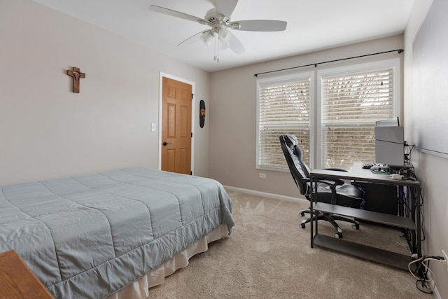 bedroom featuring multiple windows, light colored carpet, and ceiling fan