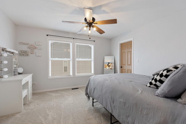 bedroom featuring ceiling fan and light colored carpet