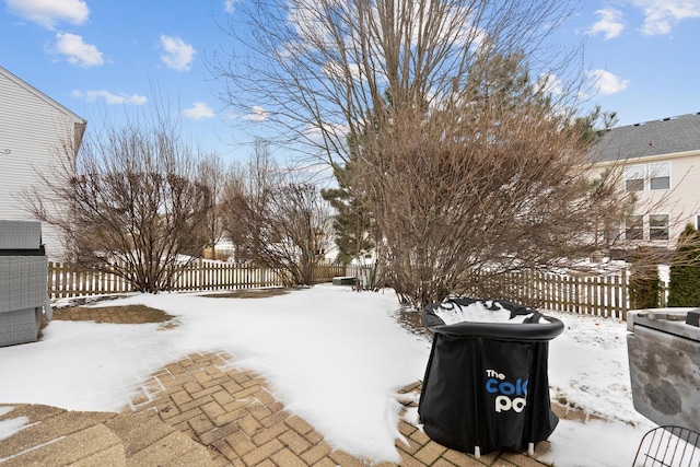 view of yard layered in snow