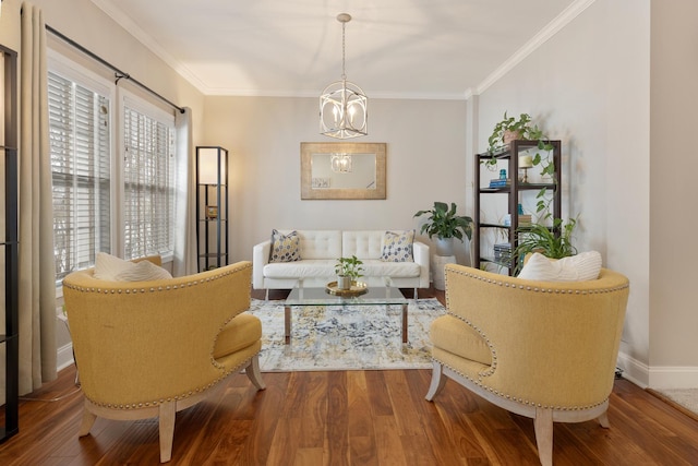 living area featuring ornamental molding, hardwood / wood-style floors, and a chandelier