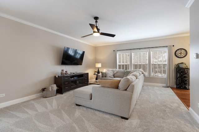 living room with light carpet, ornamental molding, and ceiling fan