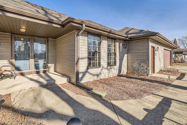 view of side of property with a garage