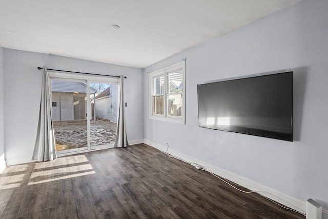 unfurnished living room with hardwood / wood-style floors