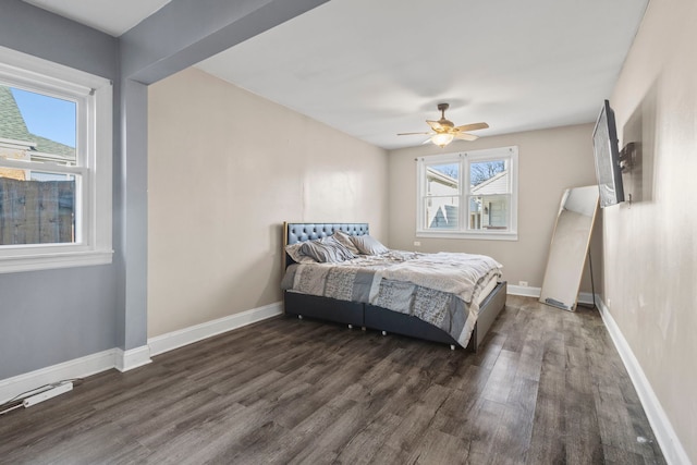 bedroom featuring dark hardwood / wood-style flooring and ceiling fan