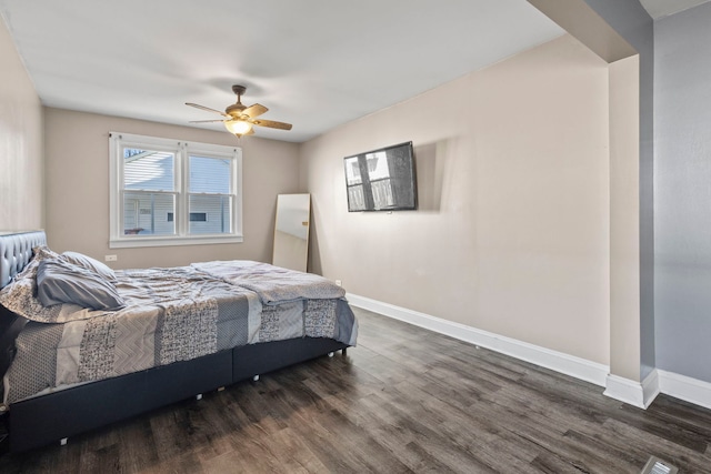 bedroom featuring dark hardwood / wood-style flooring and ceiling fan