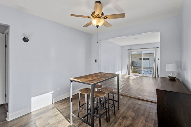 dining area featuring hardwood / wood-style floors and ceiling fan