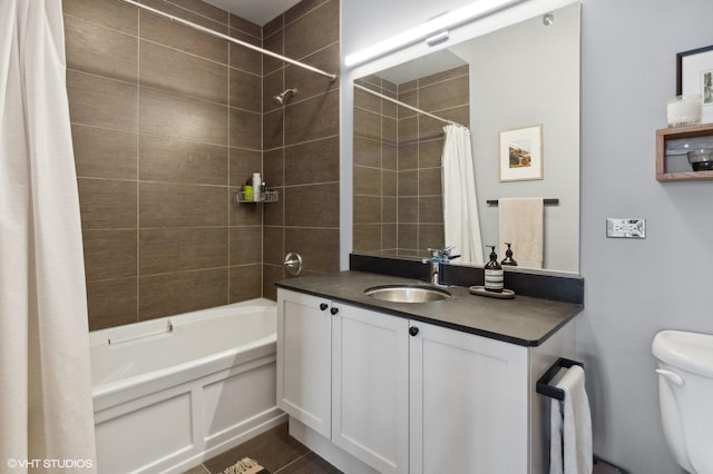 full bathroom with shower / bath combo with shower curtain, toilet, and vanity