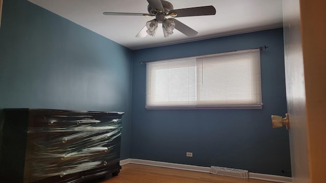 interior space with hardwood / wood-style floors and ceiling fan