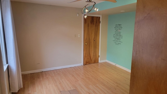 empty room featuring ceiling fan and light wood-type flooring