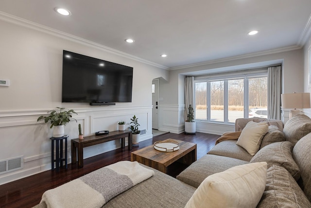 living room featuring ornamental molding and dark hardwood / wood-style floors