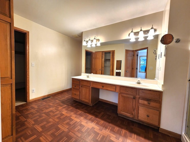 bathroom featuring vanity and parquet floors