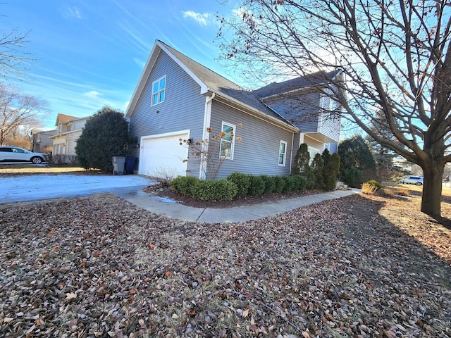 view of side of property with a garage