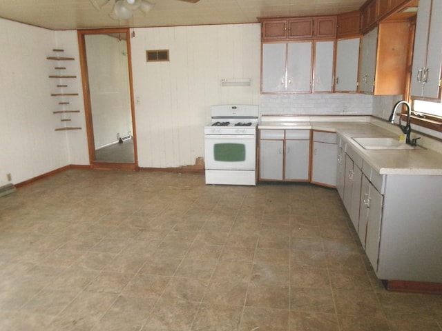 kitchen featuring sink and white range with gas stovetop