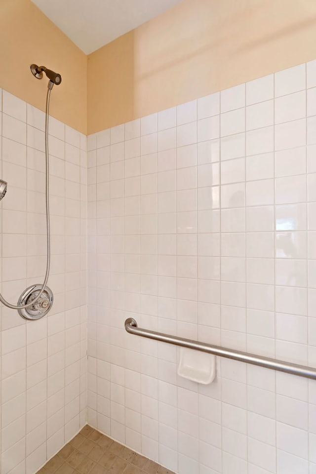 bathroom with tiled shower