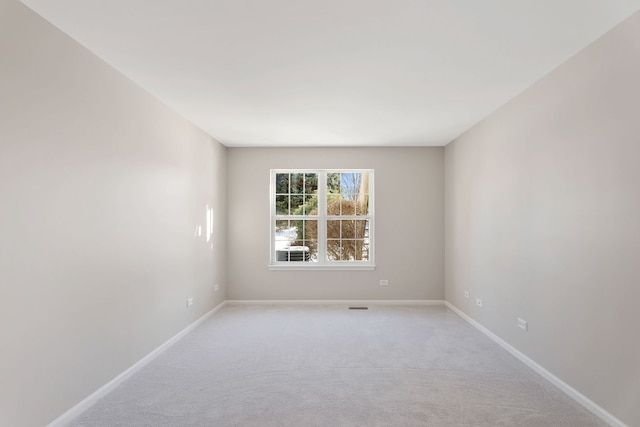 empty room with light colored carpet