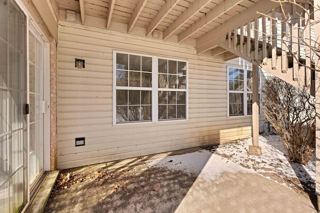 view of side of property featuring a patio