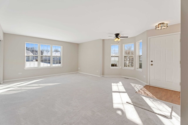 interior space featuring ceiling fan