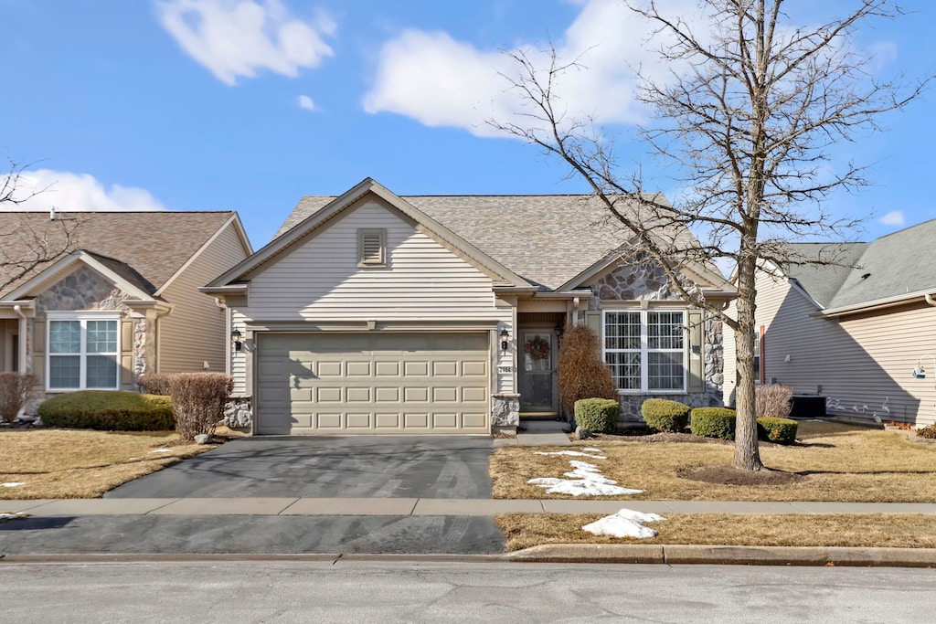 single story home with a garage