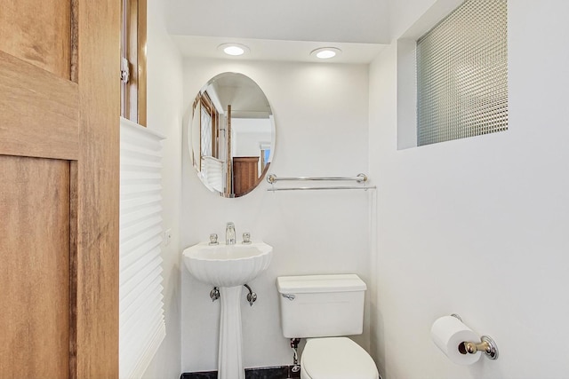 bathroom with sink and toilet