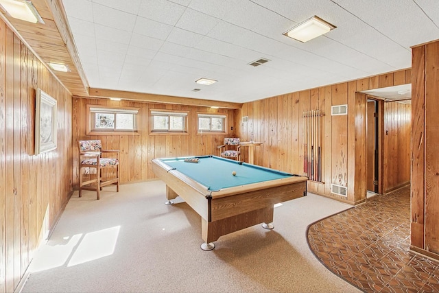 recreation room with pool table, wooden walls, and carpet