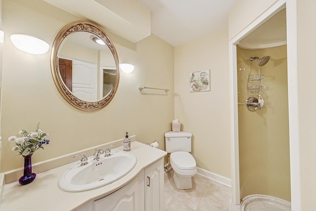 bathroom featuring vanity, tile patterned floors, toilet, and walk in shower