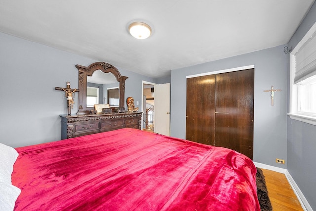 bedroom featuring hardwood / wood-style flooring and a closet