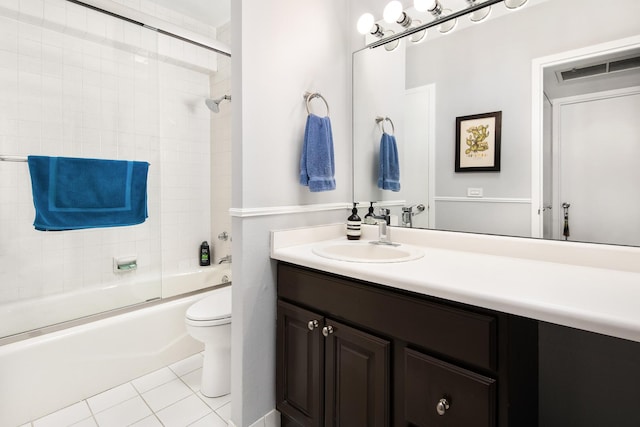 full bathroom with enclosed tub / shower combo, vanity, toilet, and tile patterned floors